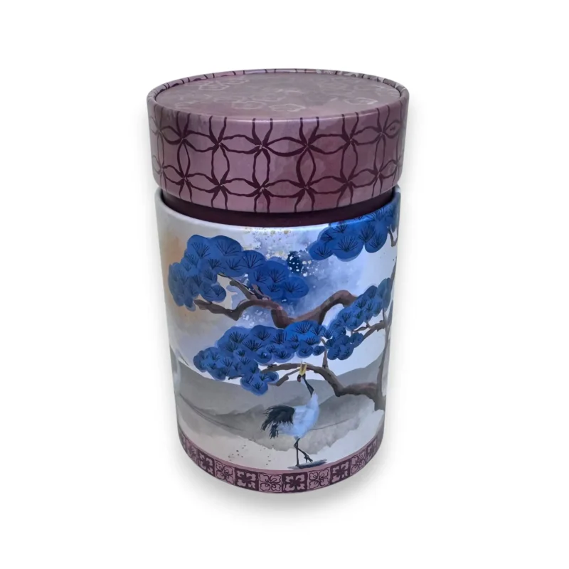 Raudonas arbatos indelis su gervės piešiniu ir ornamentais