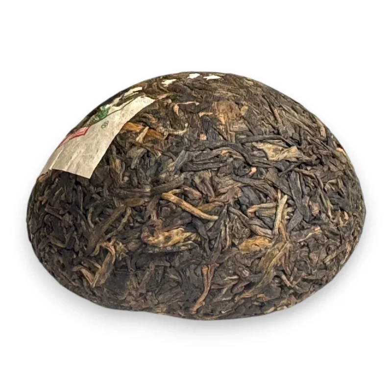 Presuotos XiaGuan Jia Ji Sheng Pu-erh arbatos lizdo forma iš šono