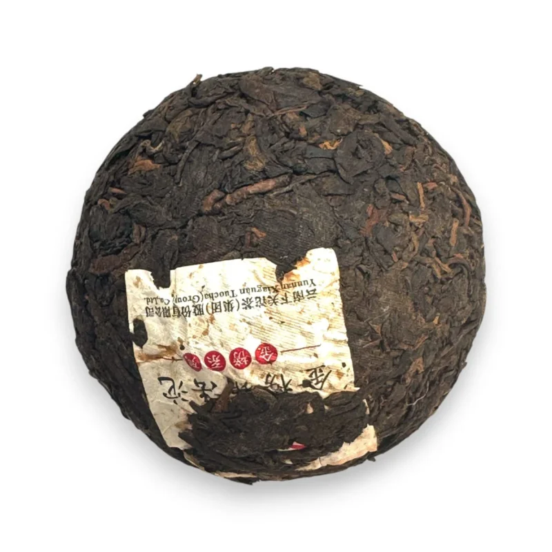 Tamsūs fermentuoti Pu-erh arbatos lapeliai su įspausta XiaGuan etikete