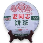 Lao Tong Zhi 9948 Sheng Pu-erh arbatos blynas su saulėgrąžų logotipu