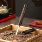 Tamsaus medžio Puerh peilis Drakonas ir Feniksas su užsukamu dangteliu